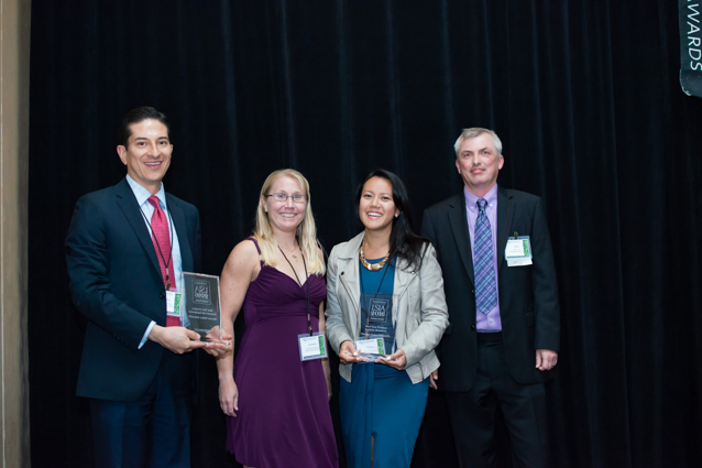 Representatives of Thermo Fisher accept one of the company’s three awards